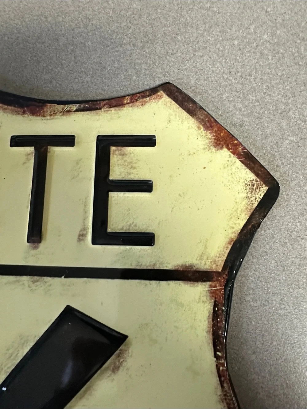 Open Road Brands Route 66 Metal Shield Wall Sign in Yellow and Black